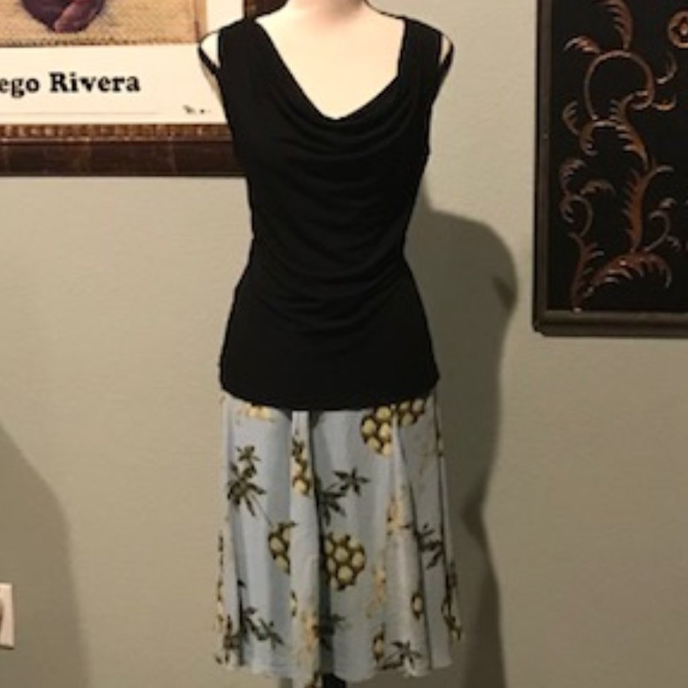 Get the outfit! Powder blue silk skirt and black cowl neck top